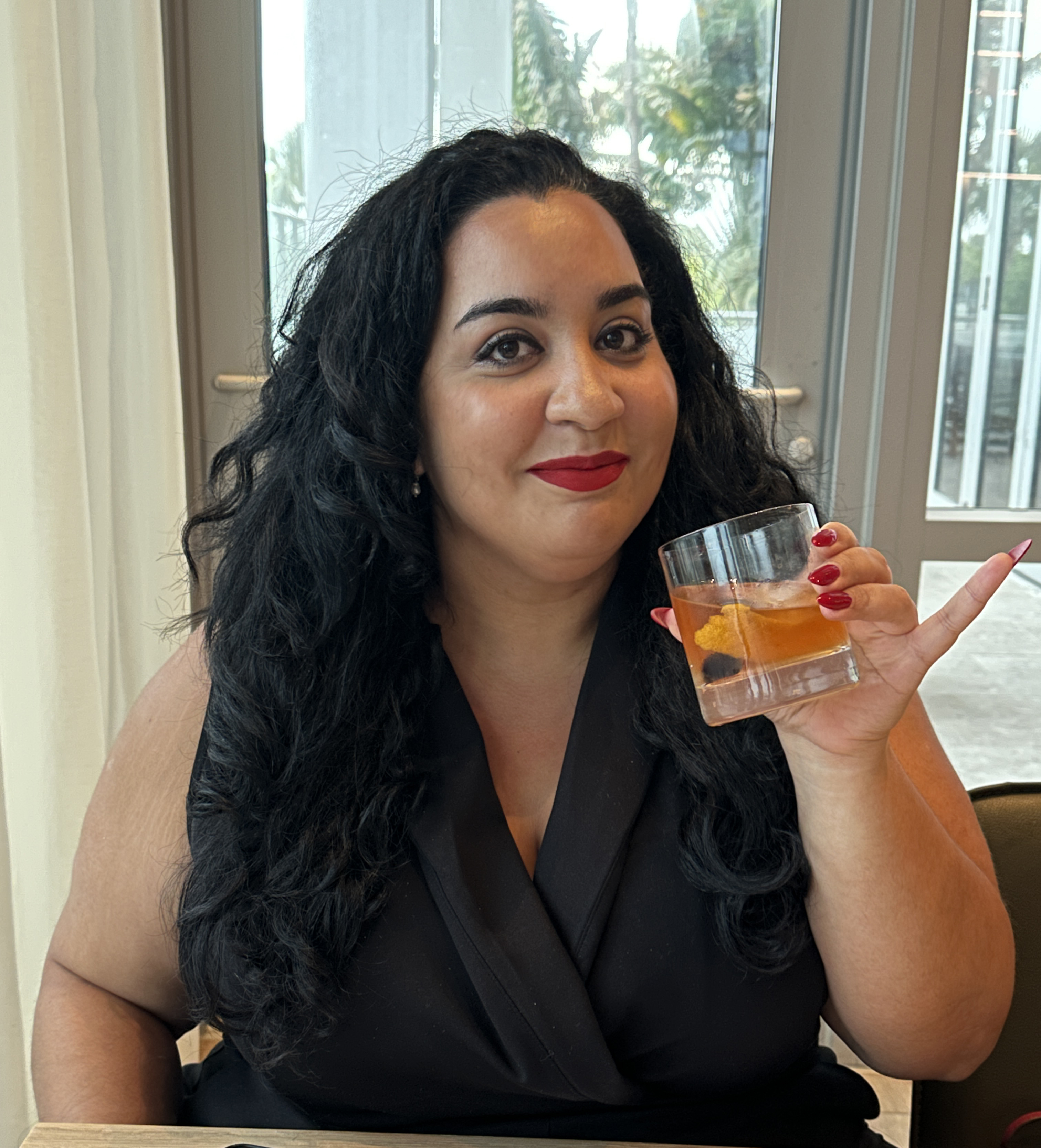 Alexandra Gomez, MAC-MAG's Managing Editor, enjoying Smoke on the Water, a refreshing cocktail at The Birdie by David Burke.