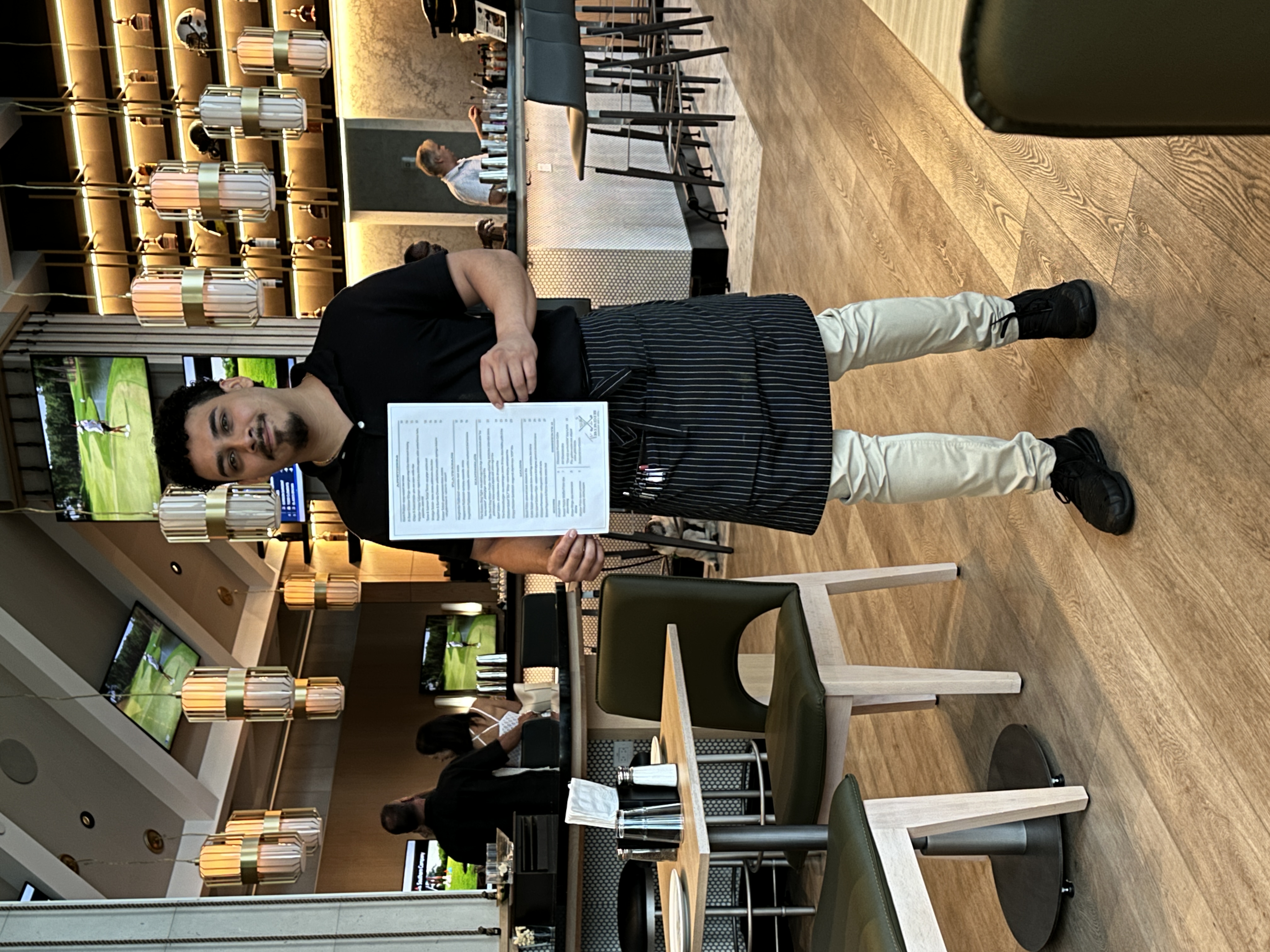Gustavo, a friendly server at The Birdie by David Burke. 